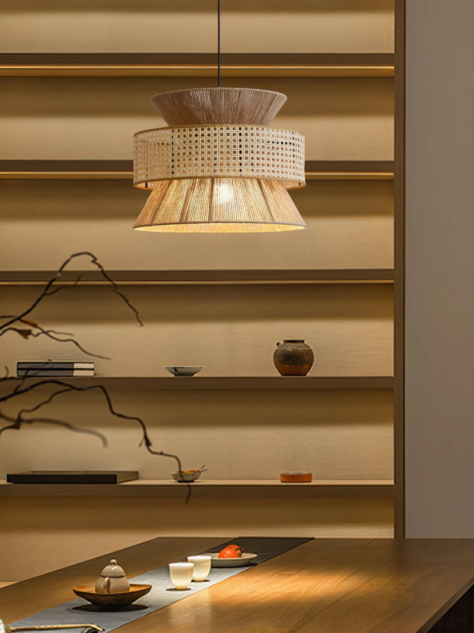 Three-tier natural rattan woven pendant lamp demonstrating light diffusion through open-weave shade