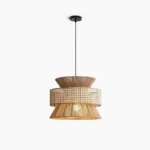 Tribe woven rattan pendant lamp with tiered layered shade and natural honey tone finish on white studio background