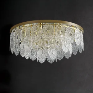Unlit Trillion ceiling lamp close-up showing embossed carved crystal pendants and brushed gold metal frame
