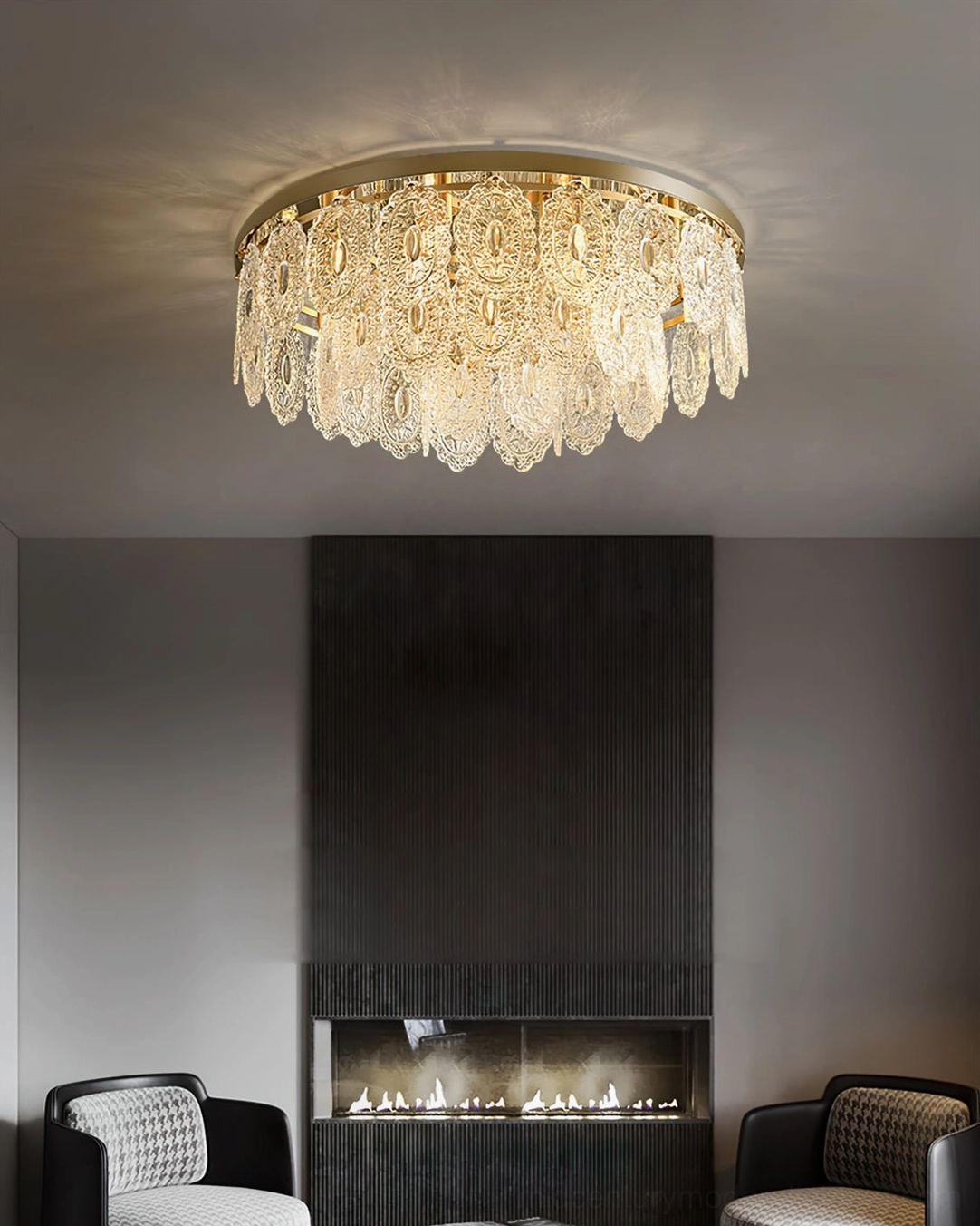 Trillion ceiling lamp installed in modern living room with fireplace, warm ambient lighting with tassel crystal pendants