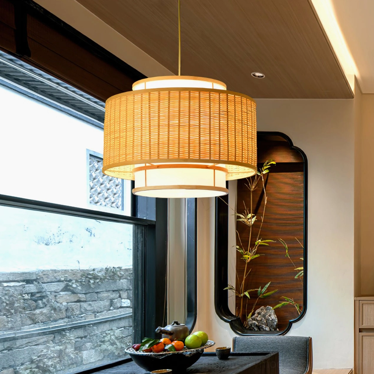 Trinidad bamboo pendant fixture side angle in Chinese-style dining nook with stone architectural details