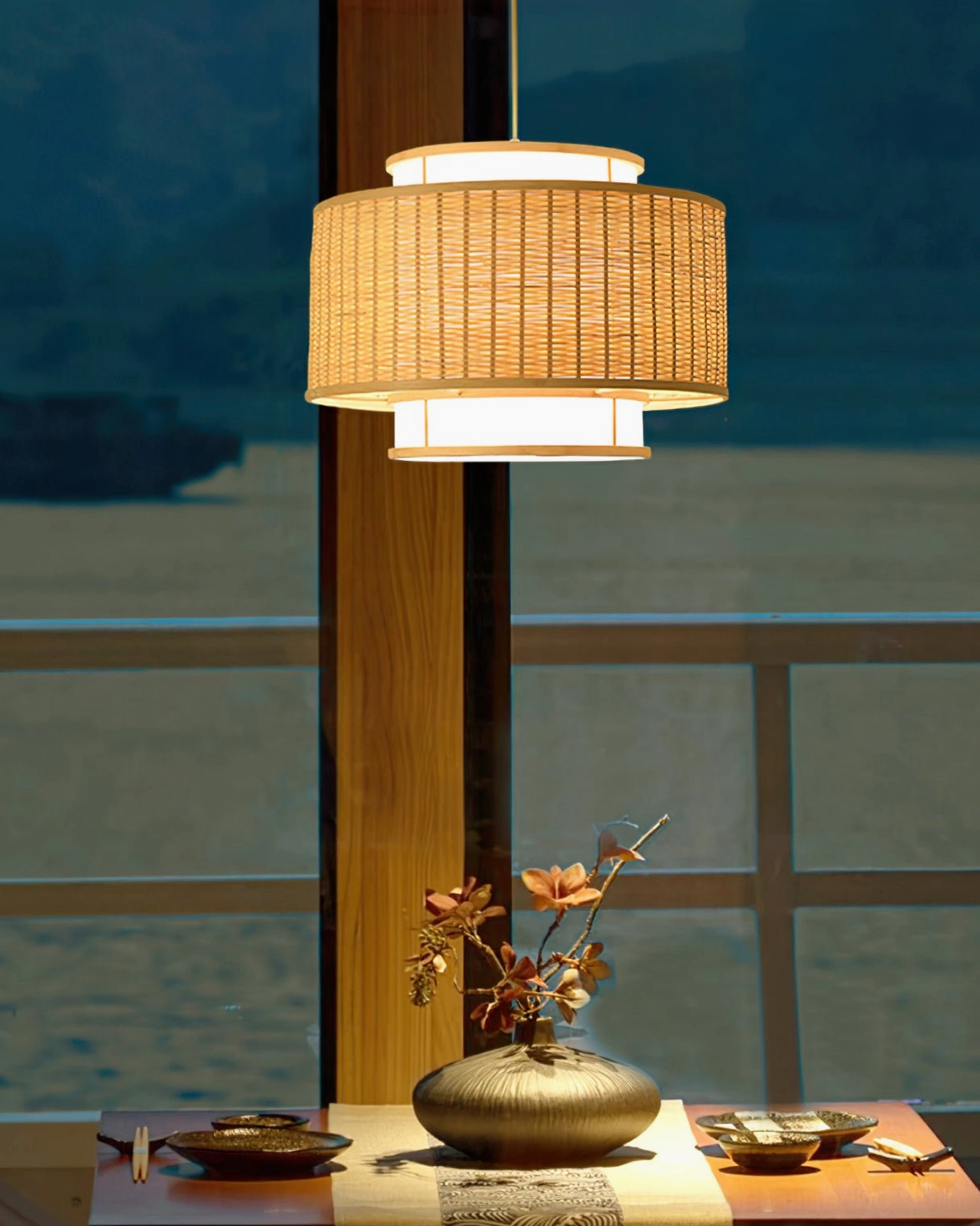 Trinidad bamboo pendant light low frontal view in Japanese tea dining area with flower decor