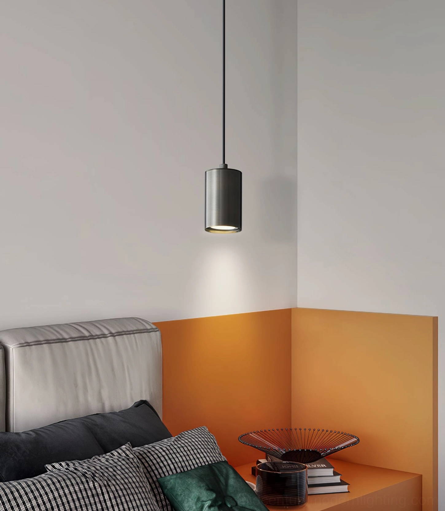 Black trio pendant light fixture in modern orange accent bedroom - neutral minimalist styling
