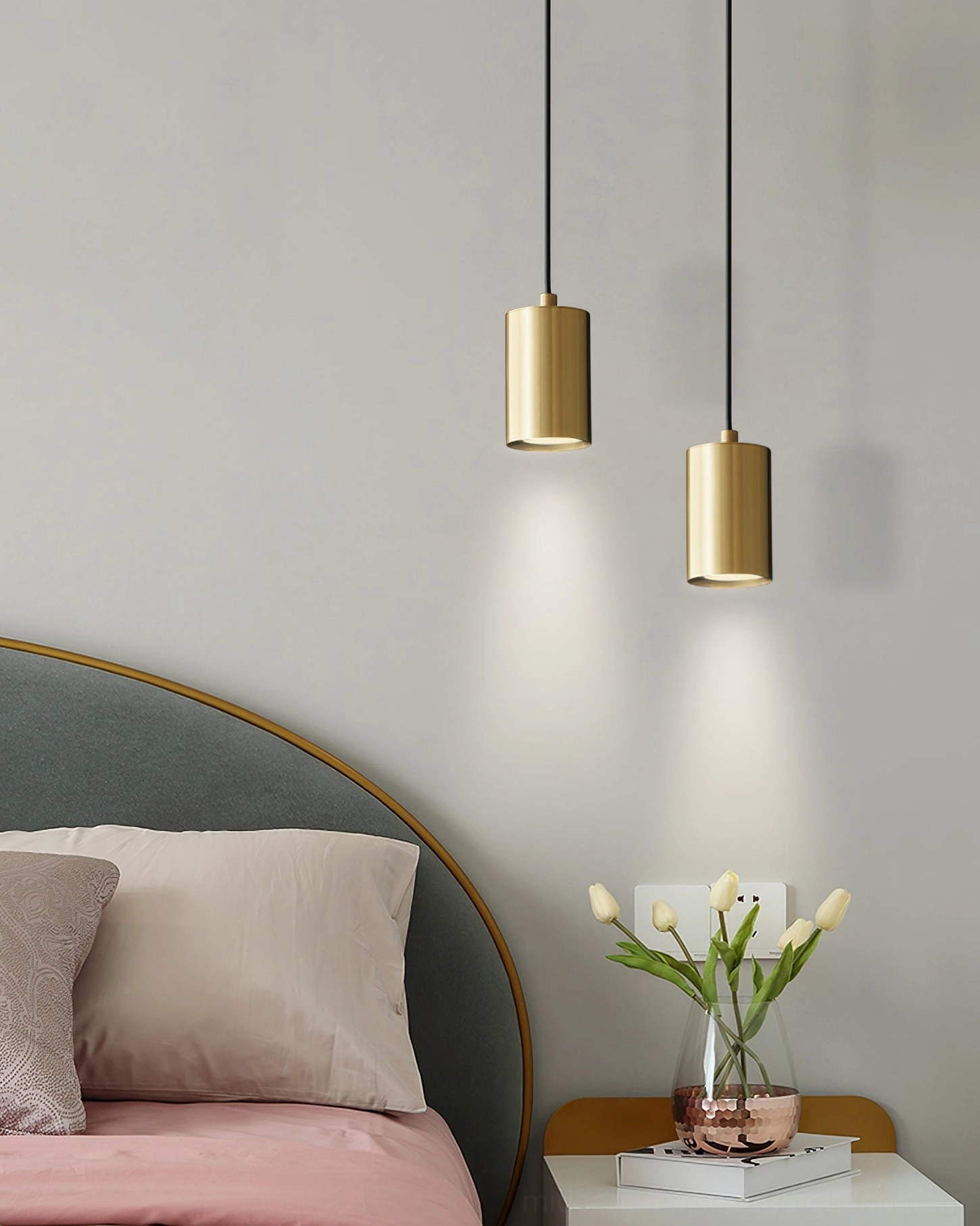 Trio brass pendant with warm LED bulb glowing - ambient modern lighting atmosphere