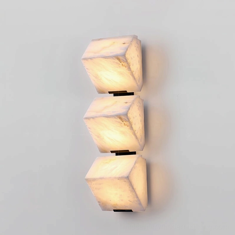 Three-light alabaster staircase lamp installed in bedroom showing dramatic warm ambient lighting and stone beauty