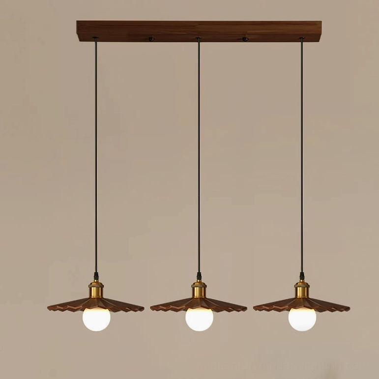 Triple geometric walnut wood pendant lights creating dramatic lighting installation - 3-light configuration statement piece