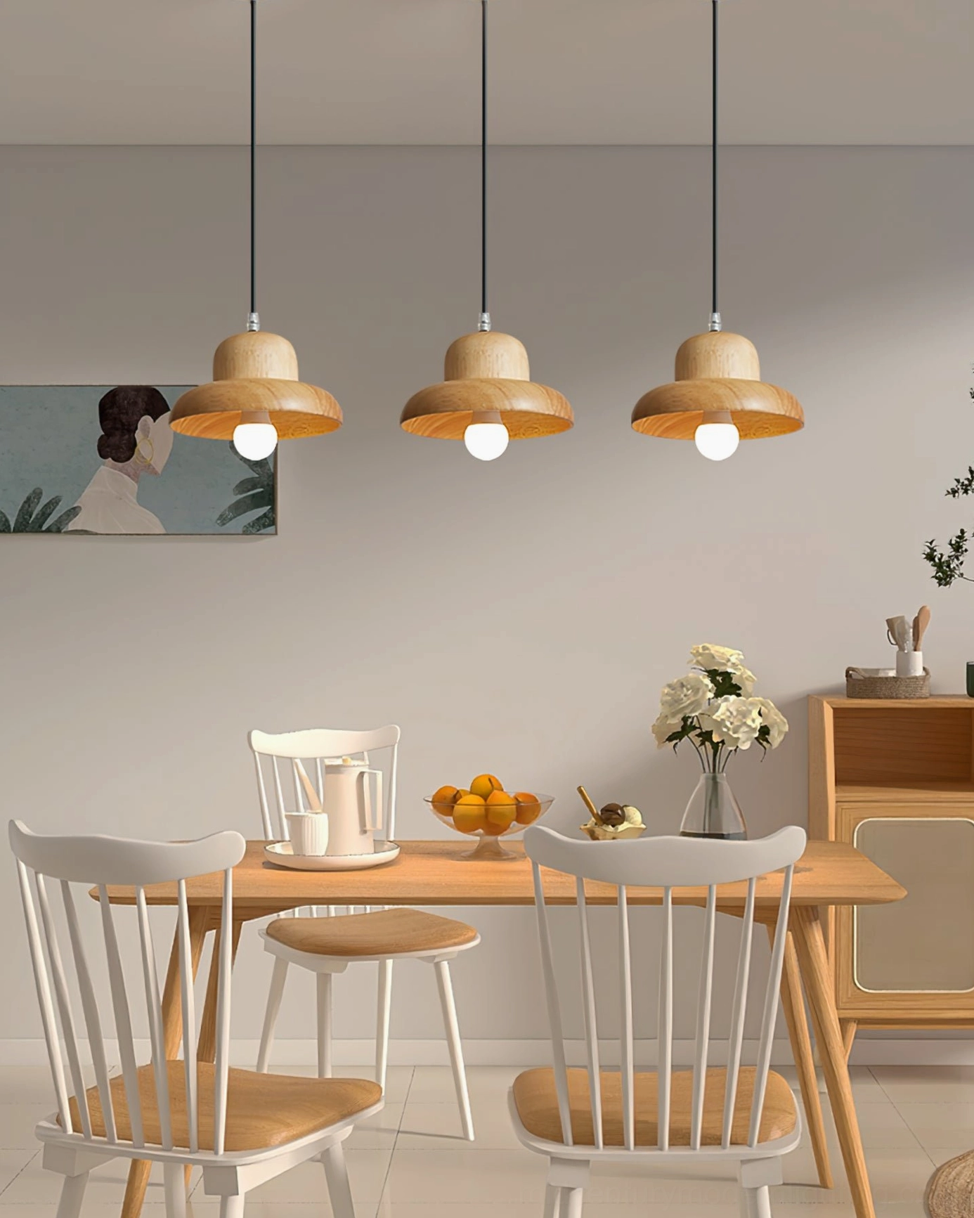 Triple wooden pendant lamps in Japanese minimalist dining room creating coordinated warm lighting arrangement