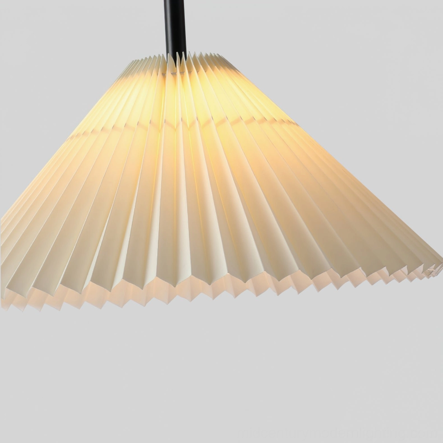Modern tripod floor lamp in minimalist bedroom or reading corner, demonstrating how arc design provides targeted lighting solution