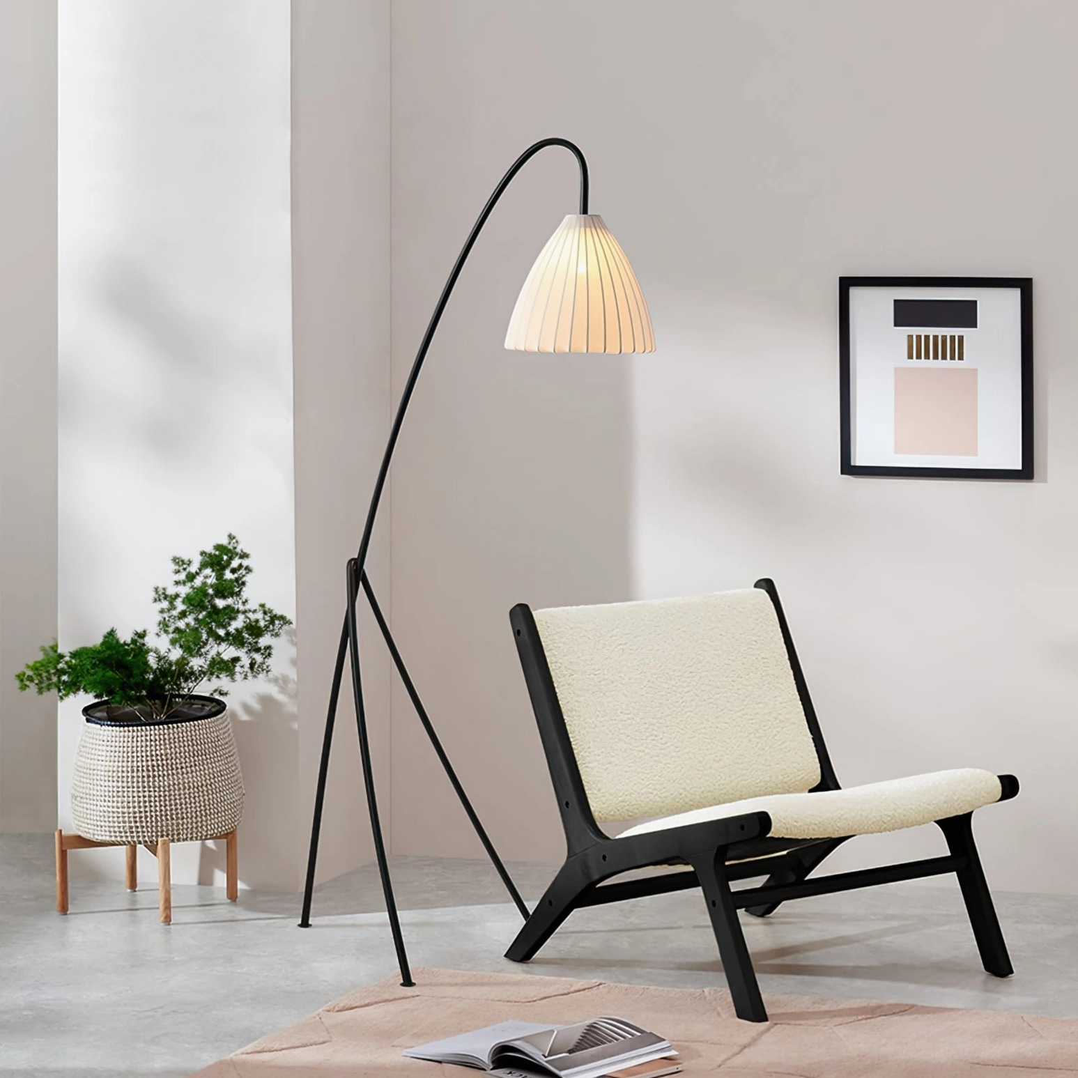Tripod floor lamp with pleated shade in modern interior, demonstrating practical task lighting and architectural design element