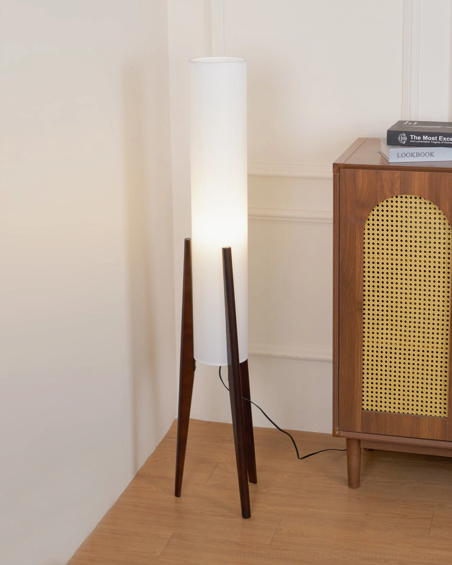 Walnut tripod floor lamp close-up of fabric shade and top assembly with light diffusion