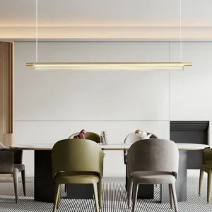 Trisel LED chandelier installed in modern dining room with gold finish, creating warm ambient lighting above dining table