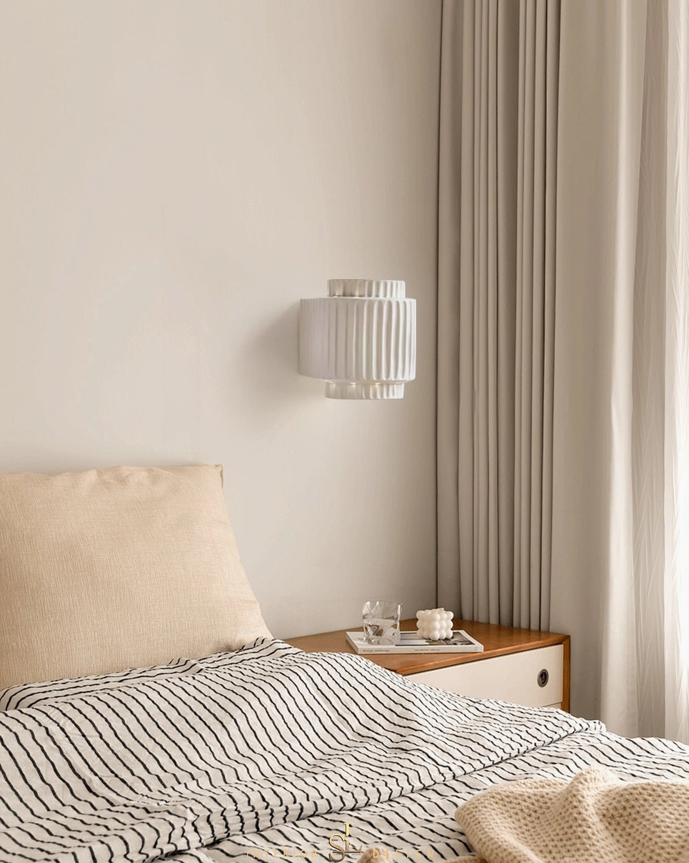Tristan fluted white wall sconce paired with minimalist Scandinavian bedroom furniture and neutral color scheme