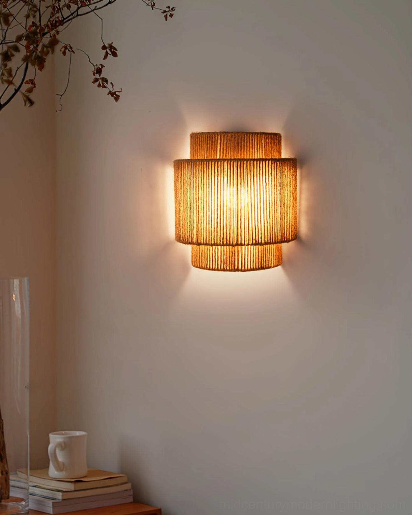 Tristan handcrafted rope wall sconce installed in contemporary bedroom, ambient lighting feature