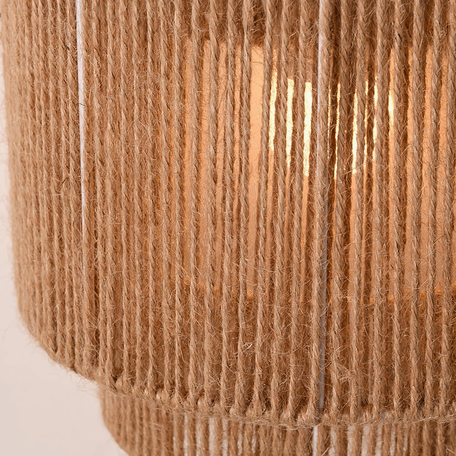 Close-up macro shot of natural jute rope weaving texture on Tristan wall sconce, artisanal detail