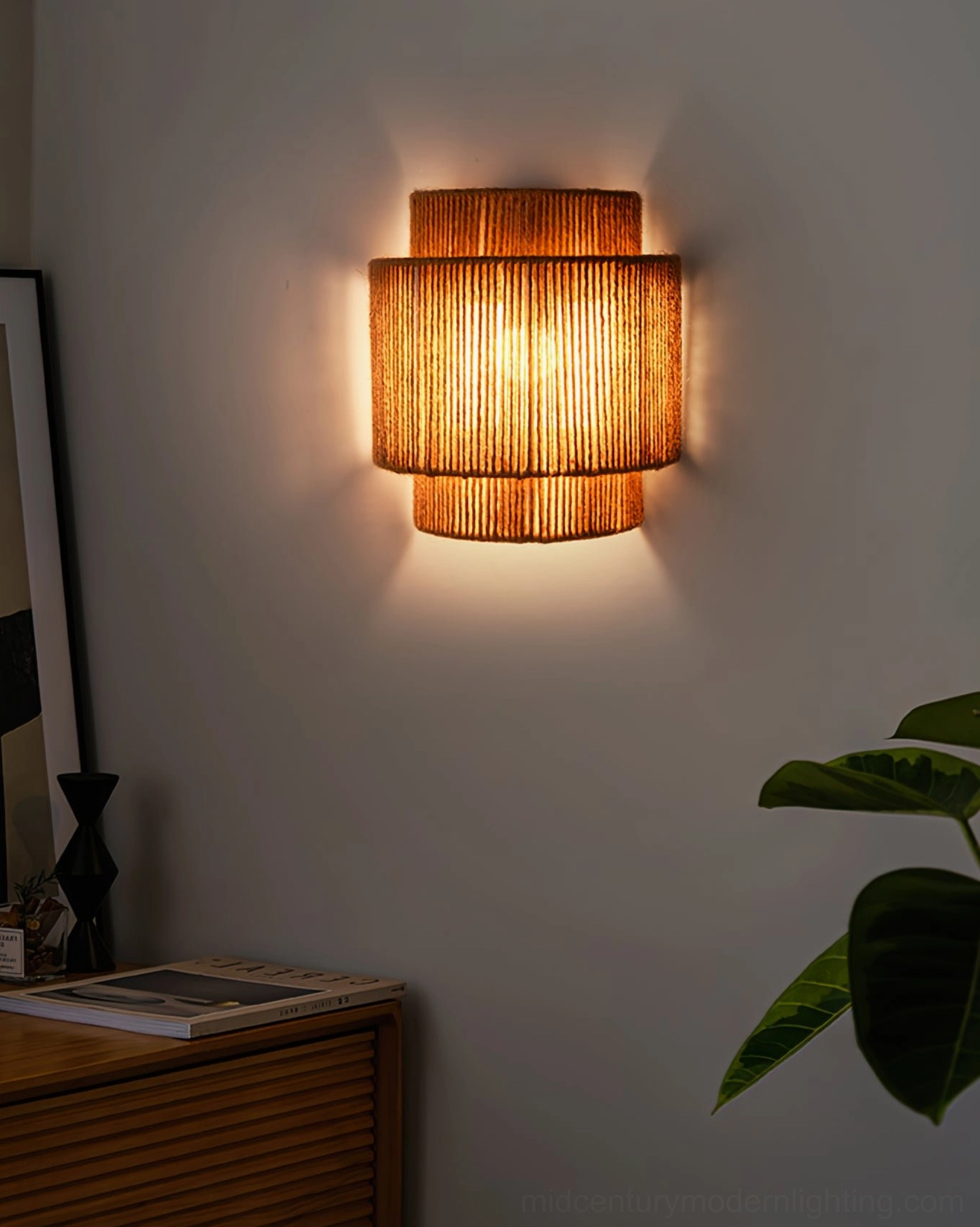 Tiered natural rope wall fixture creating sculptural shadow play with warm indirect lighting