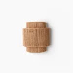 Tristan handcrafted tiered rope wall sconce with natural jute texture, bohemian lighting fixture front view
