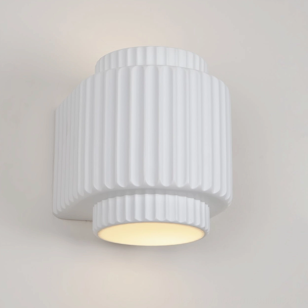 Tristan mid-century modern wall sconce showcasing sculptural vertical fluting and clean minimalist profile design