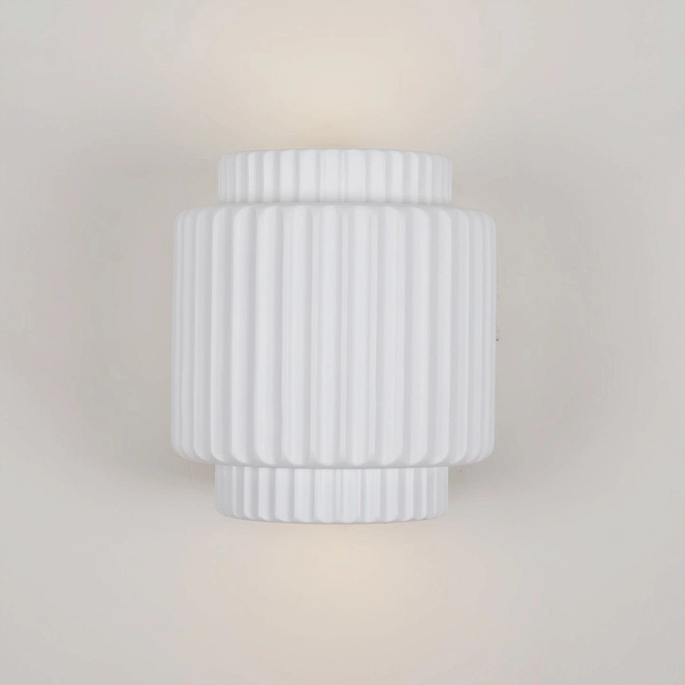 Tristan minimalist wall lamp side view revealing compact cylindrical shape and architectural mounting hardware details
