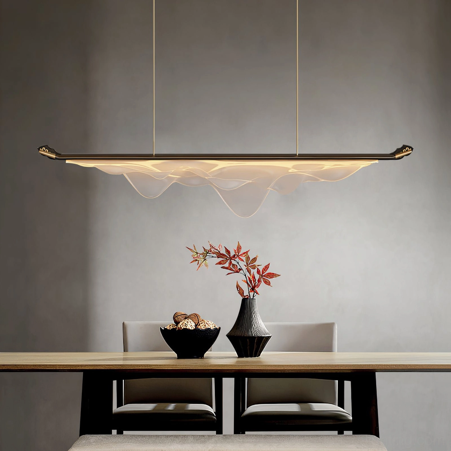 Troag pendant light above dining chairs with table centerpiece, eye-level interior view