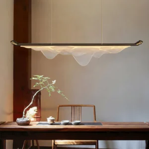 Troag pendant light suspended above dining table in warm-lit traditional tea room, mid-century modern fixture
