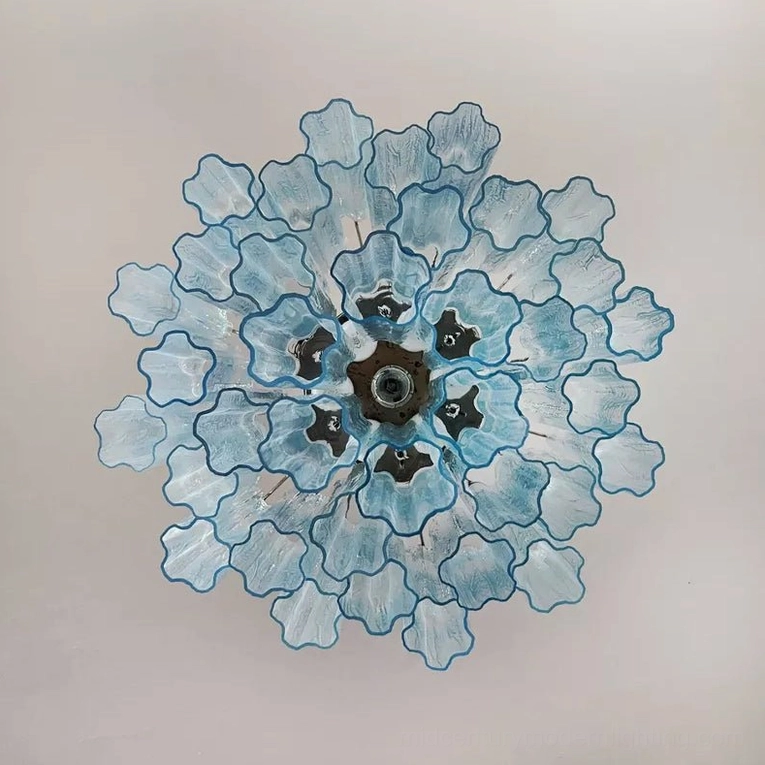 Mid-century modern glass chandelier with tiered cylinder arrangement and sophisticated light distribution