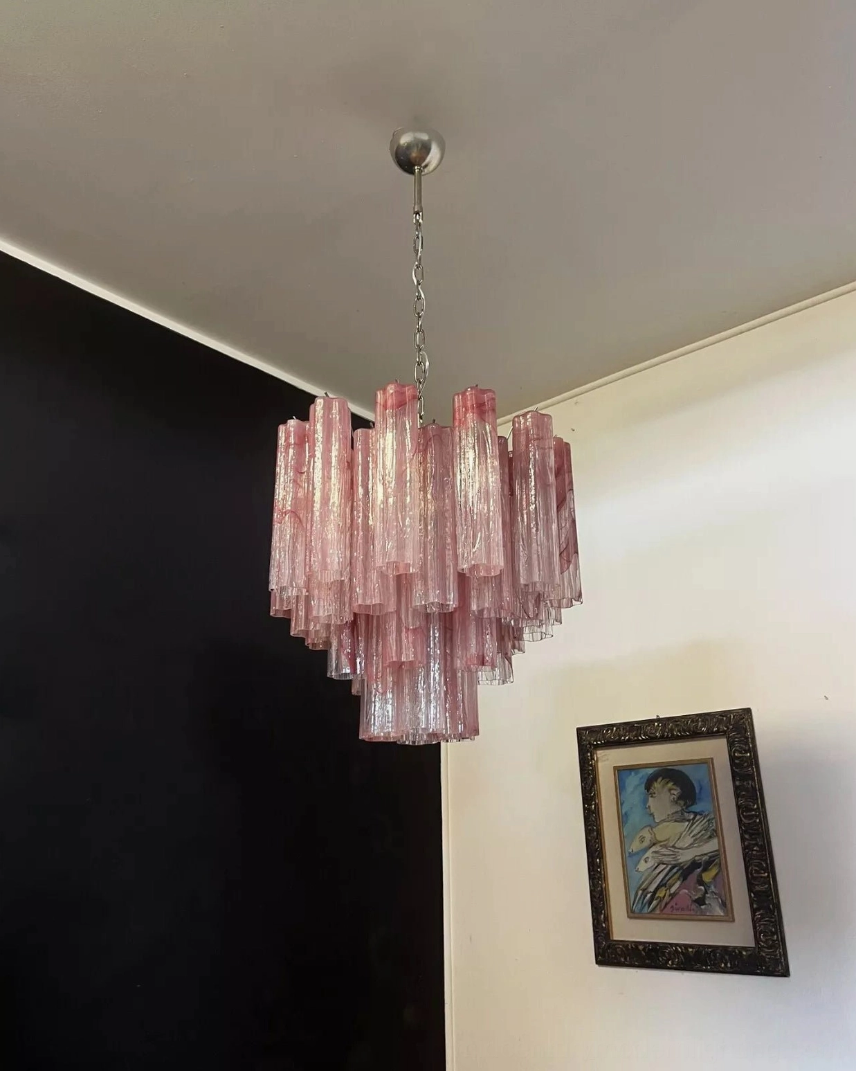 Modern sculptural glass chandelier with clean minimalist geometry and soft diffused lighting effect