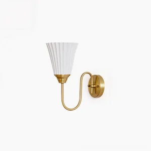 Trumpet ceramic wall sconce with pleated white shade and retro brass arm - mid-century modern design studio shot