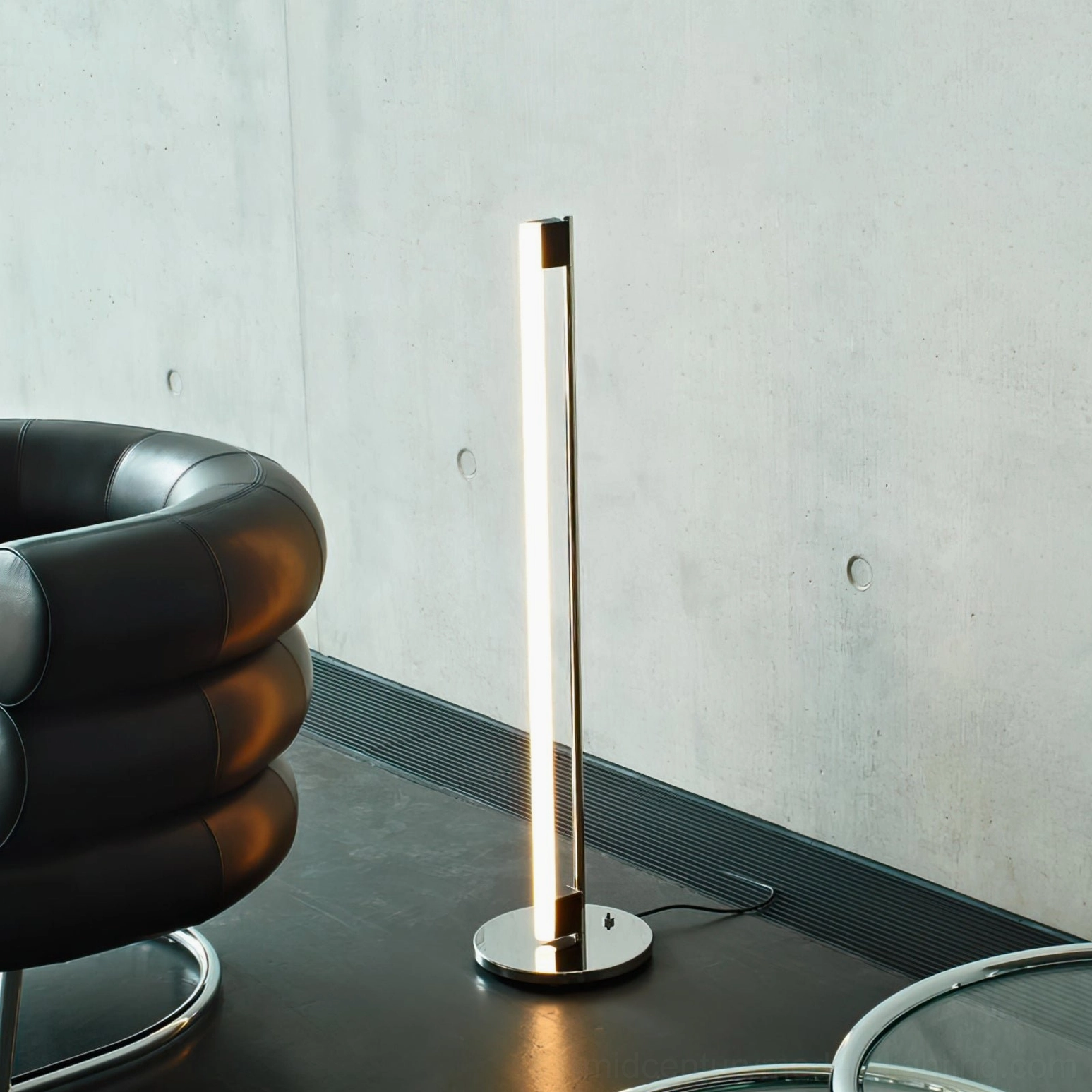 Tube LED floor lamp beside mid-century modern furniture demonstrating design compatibility and style