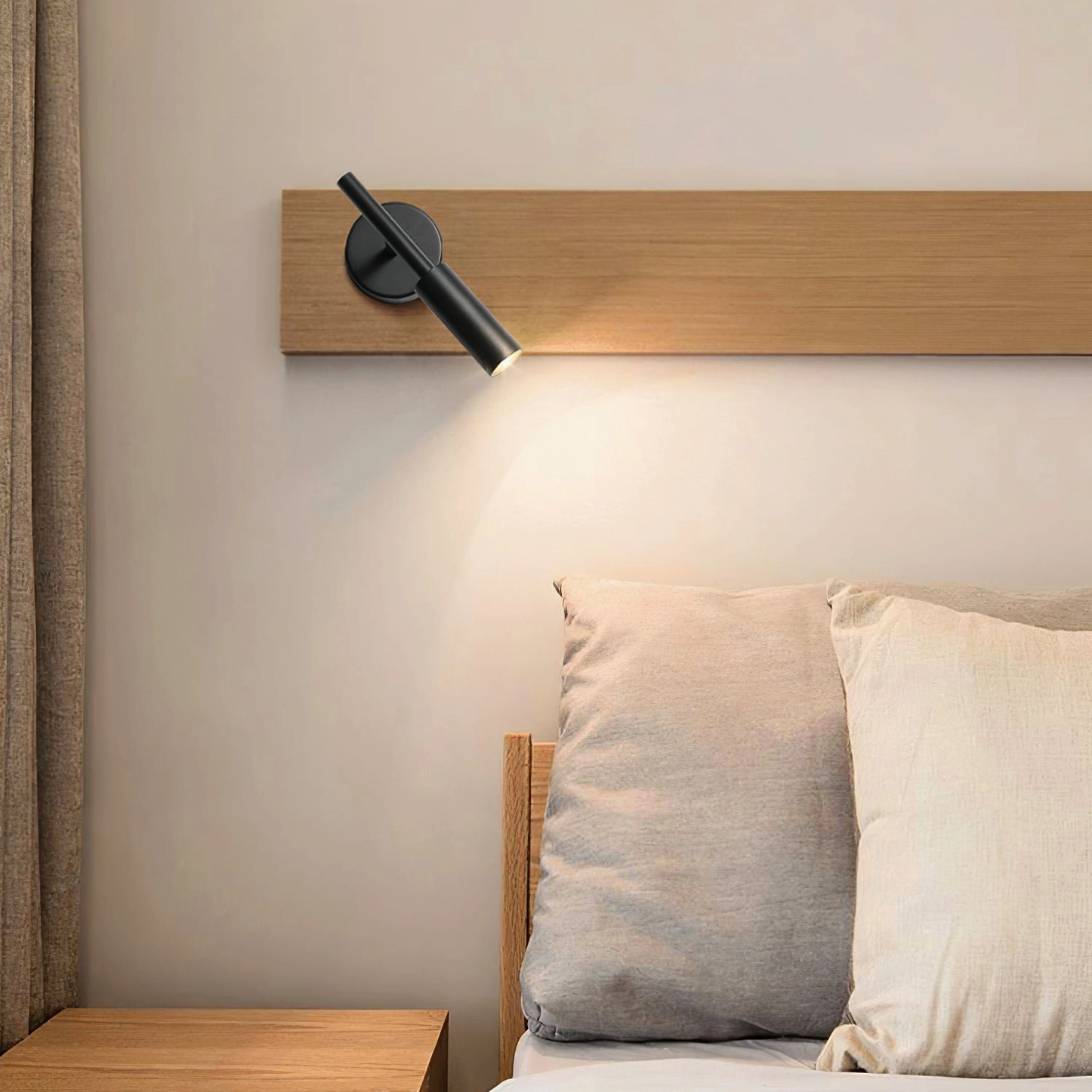 Tubino black adjustable wall lamp close-up bedside mounting on wooden headboard accent