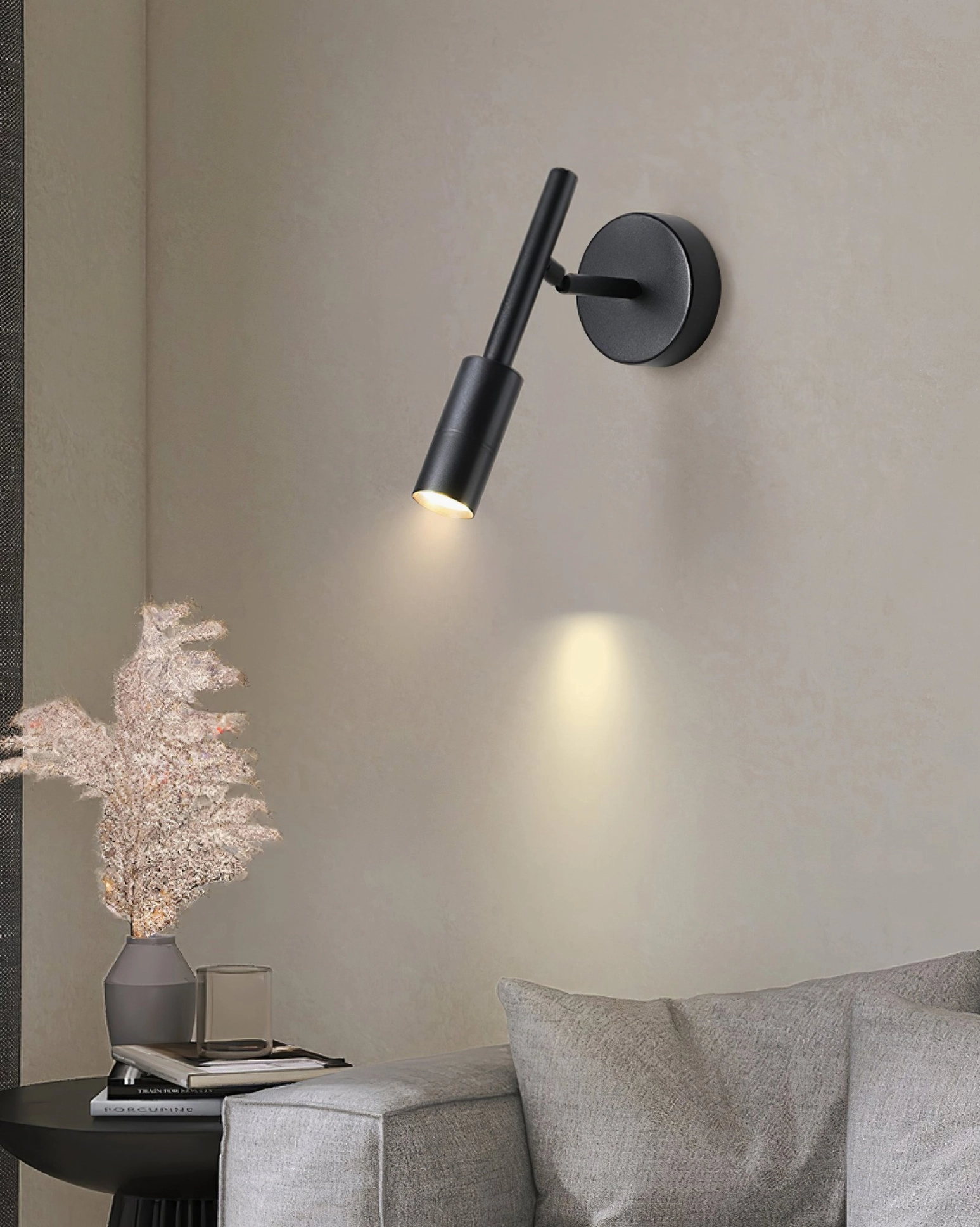 Tubino black wall spotlight in contemporary living room corner accent lighting design