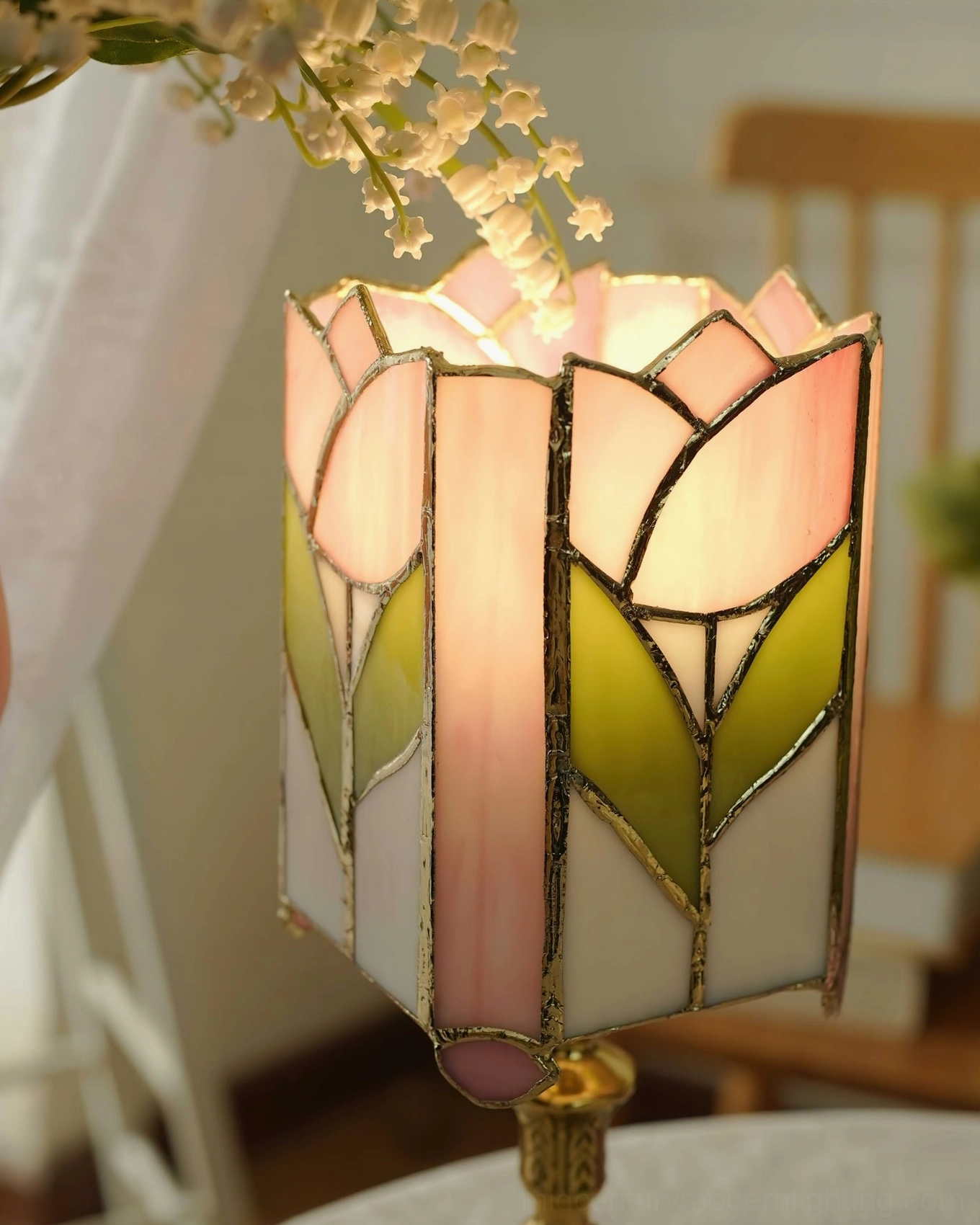 Ornate tulip Tiffany table lamp with hand-cut pink and green stained glass shade and carved brass metal base