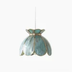 Turrella botanical glass pendant light with blue-tinted petal shade and brass hardware on white background