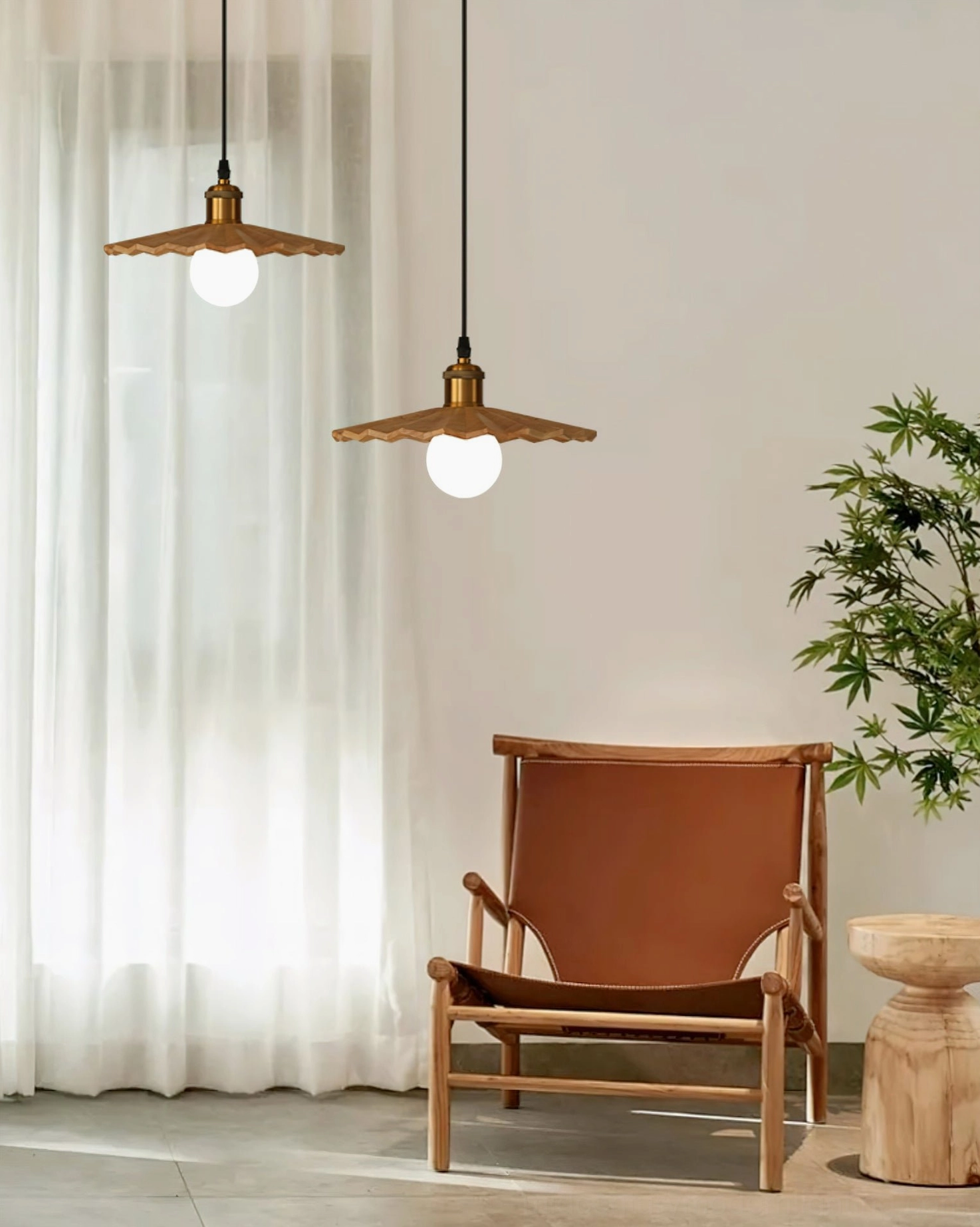 Twin geometric wooden pendant lights in living room with sheer curtains, brown leather armchair, and tropical potted plant