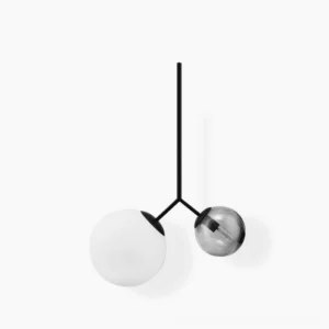 Twis asymmetric dual-globe pendant lamp with black metal frame and mixed frosted and smoky grey glass shades in modern minimalist style