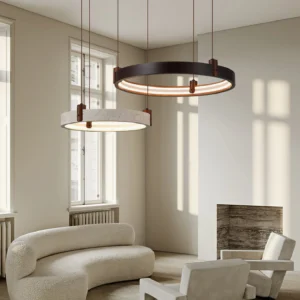 Two-head travertine pendant chandelier installed in contemporary living room setting with warm neutral decor, eye-level interior perspective