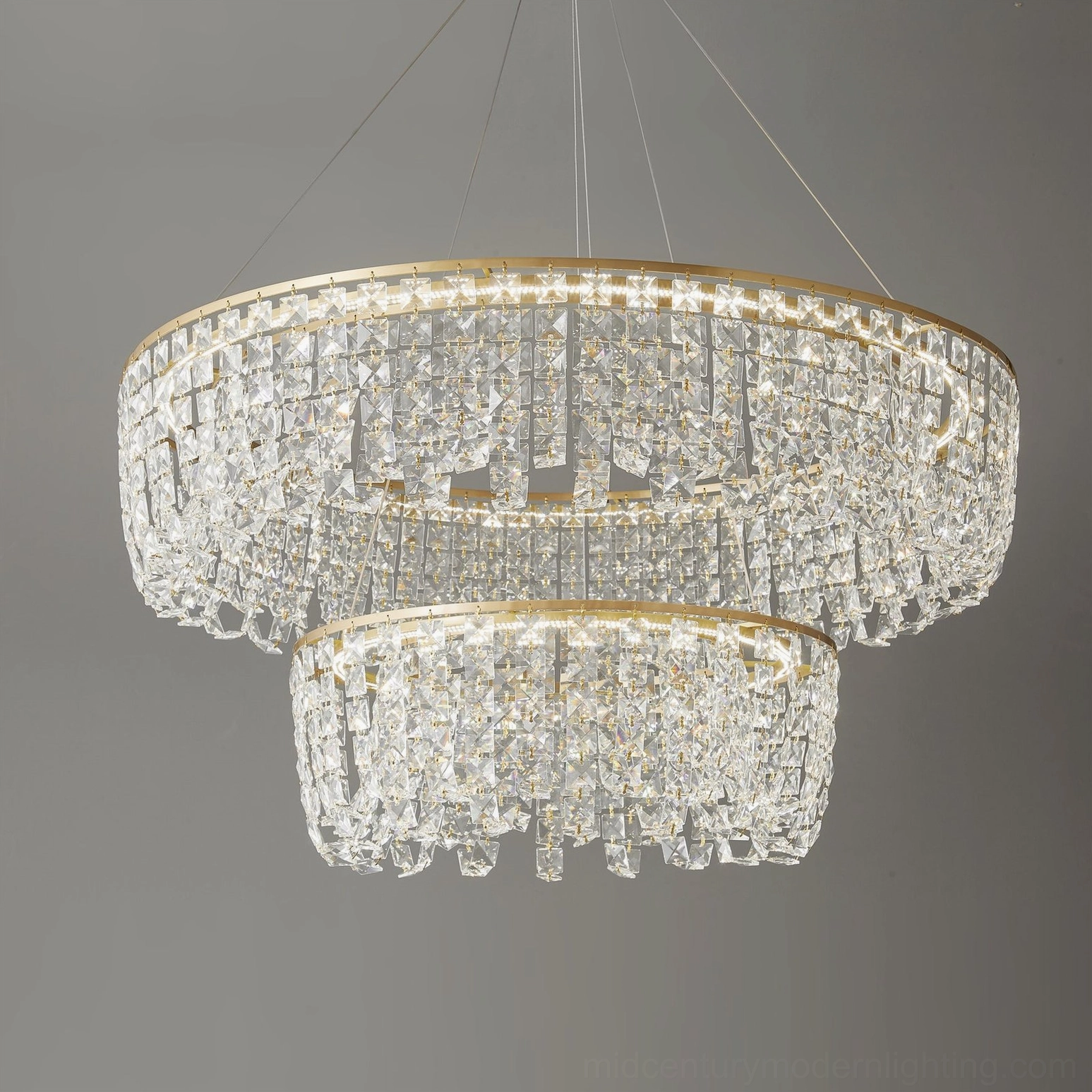 Two-tier brass crystal chandelier installed ceiling height perspective professional photography