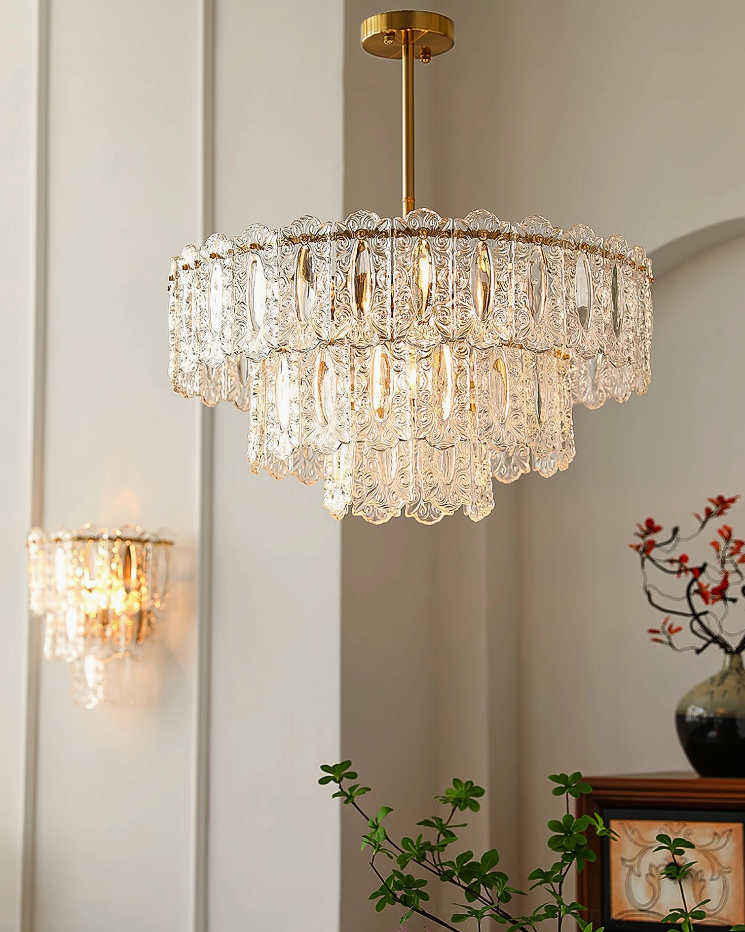 Two-tier Vienna clear crystal chandelier in minimalist modern hallway with transparent glass and wall lamp