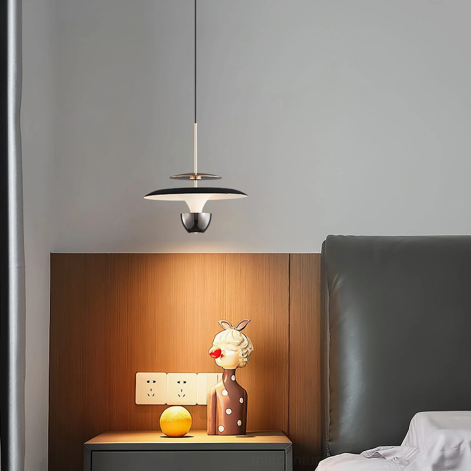 Modern matte black UFO pendant light bedside close-up