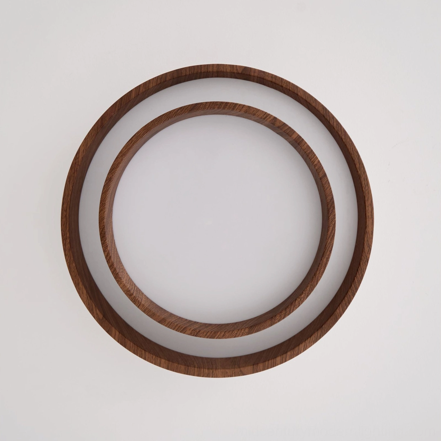 Vaako ceiling fixture detail view showing integrated LED driver acrylic diffuser construction and walnut finish