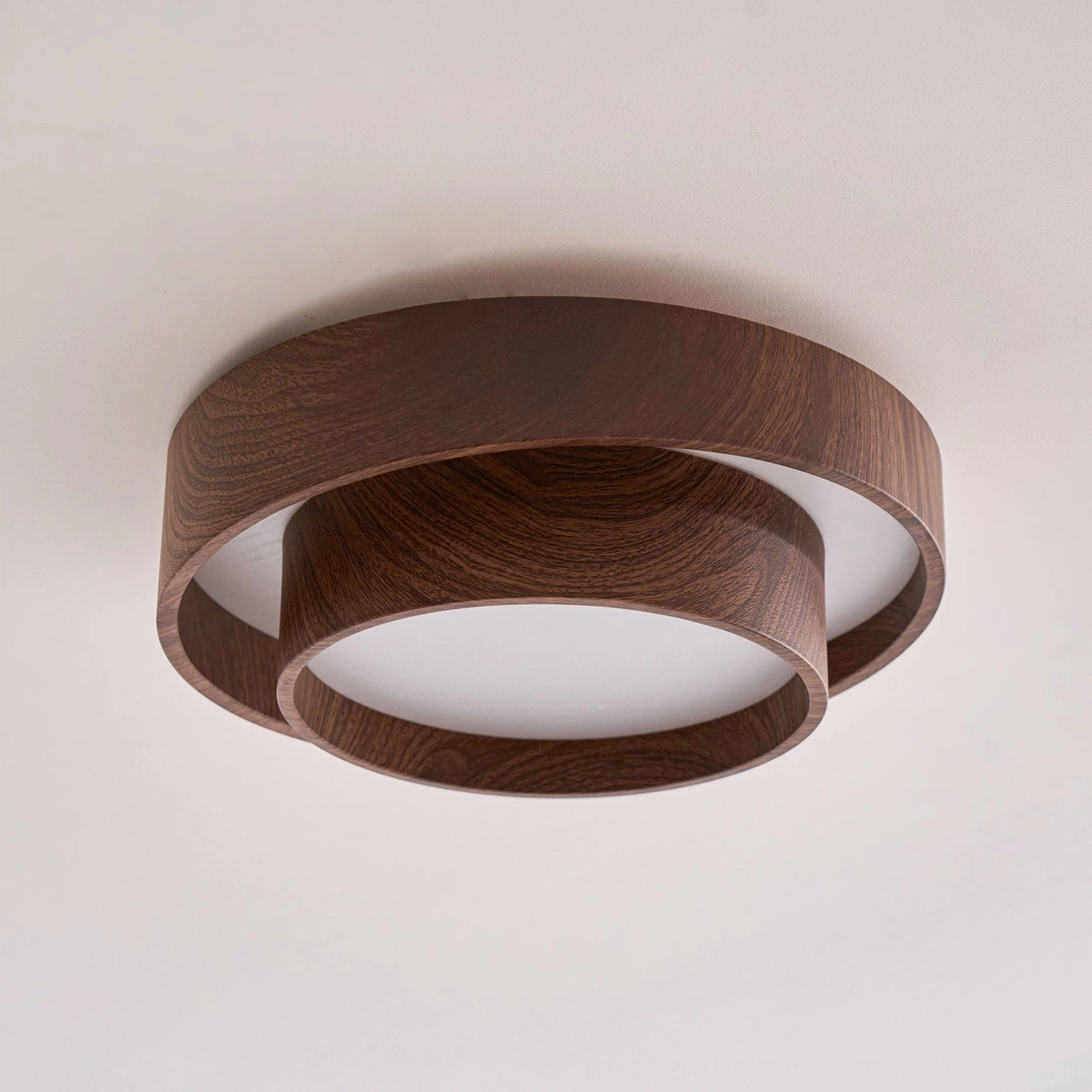 Vaako walnut ceiling lamp warm light output showcasing diffused ambient illumination for mid-century modern space