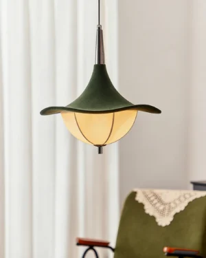 Vintage-inspired Vadar pendant lamp hanging in retro living space with sheer curtains and mid-century furniture