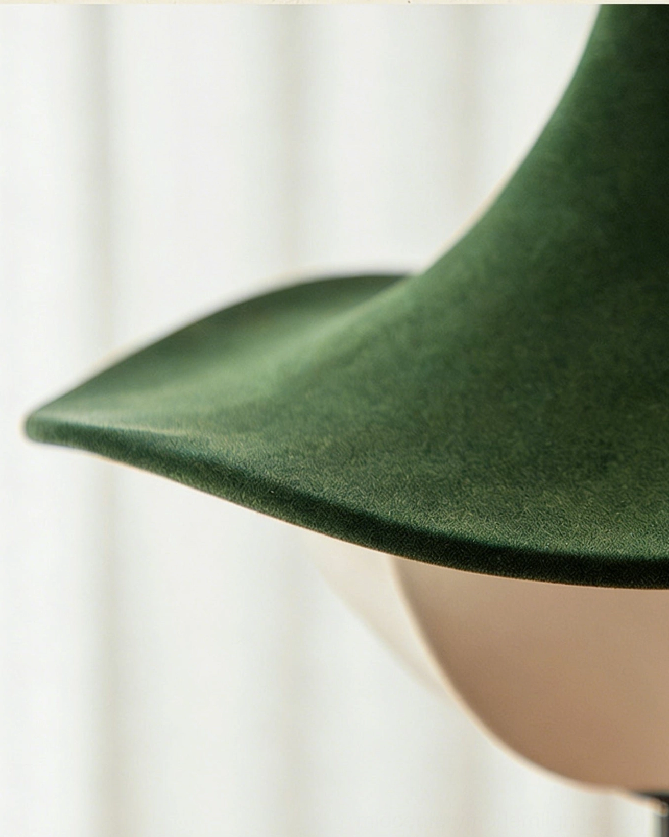 Close-up detail of Vadar pendant shade showing dark green suede texture and fabric construction