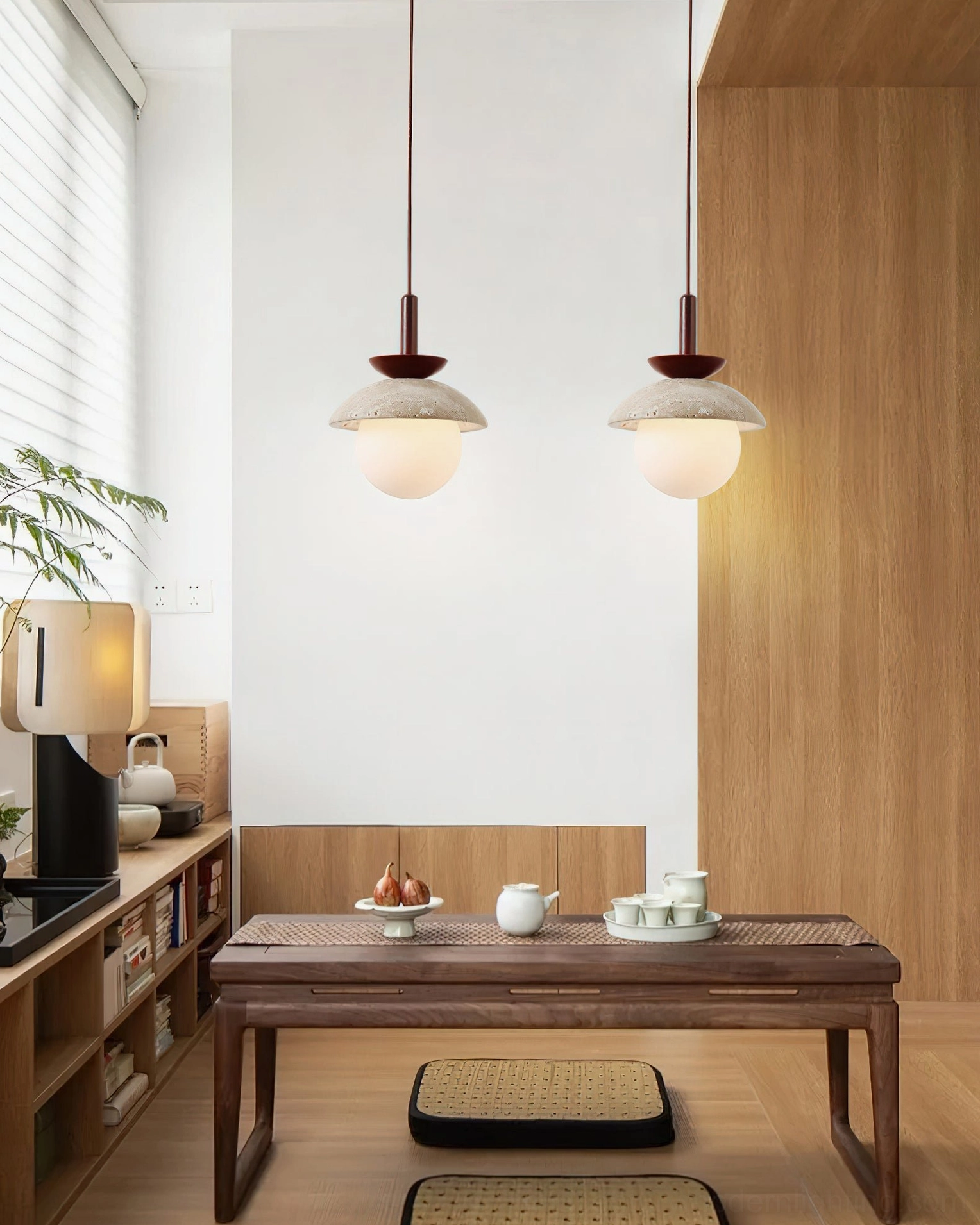 Two Valerie pendant lights hanging in Japanese minimalist tea room with natural wood furniture and wabi-sabi aesthetic