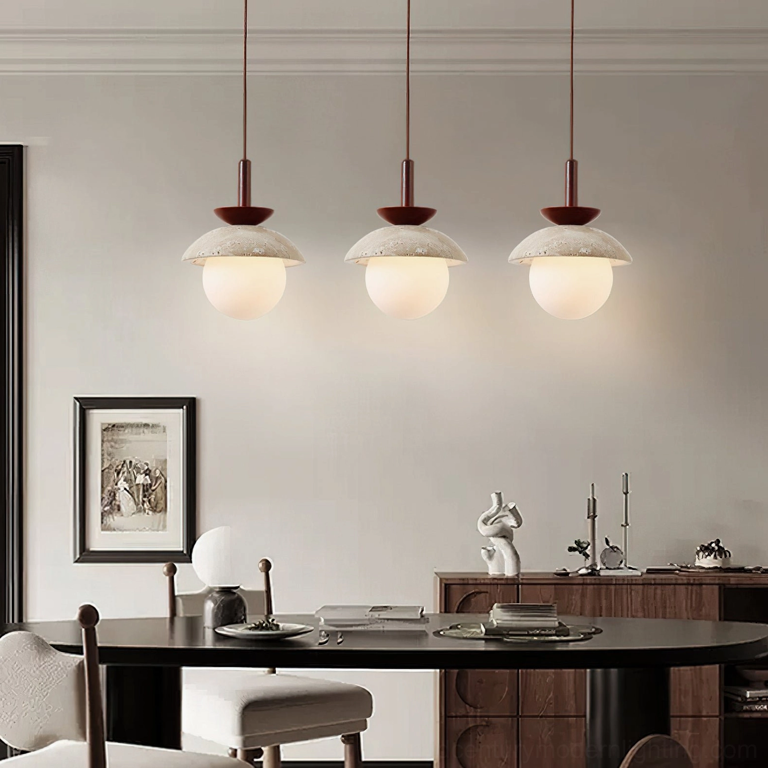 Three Valerie pendant lights suspended above modern dining table with dark wood cabinet and contemporary home decor