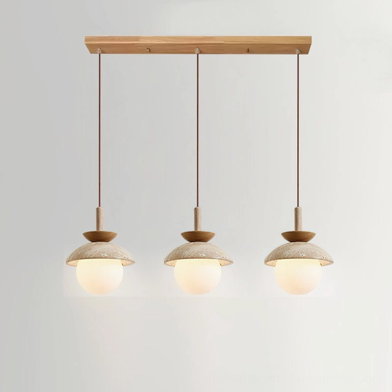 Valerie three-light pendant arrangement in natural wood tone with beige travertine shades in modern dining space