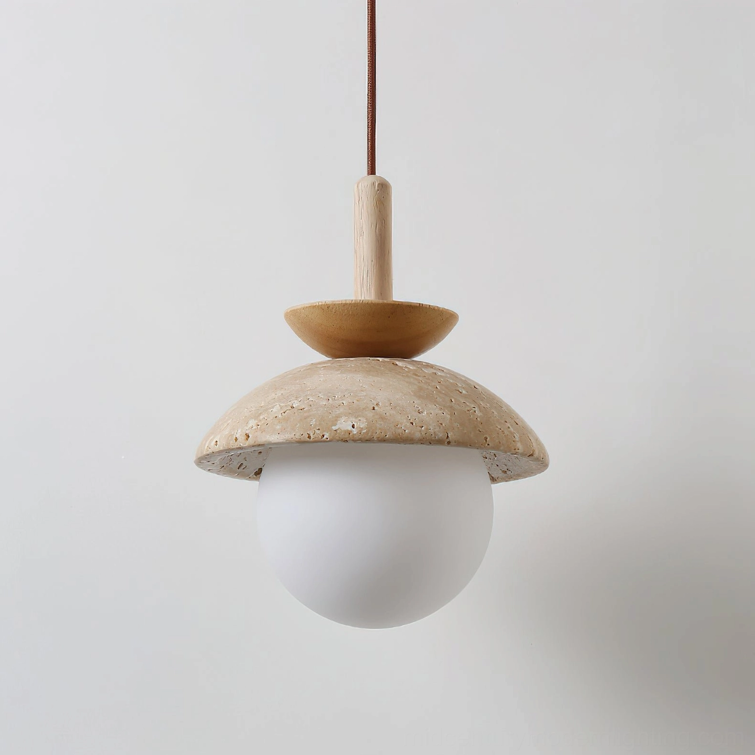 Valerie travertine pendant light shade showing natural stone color variation and soft light diffusion quality