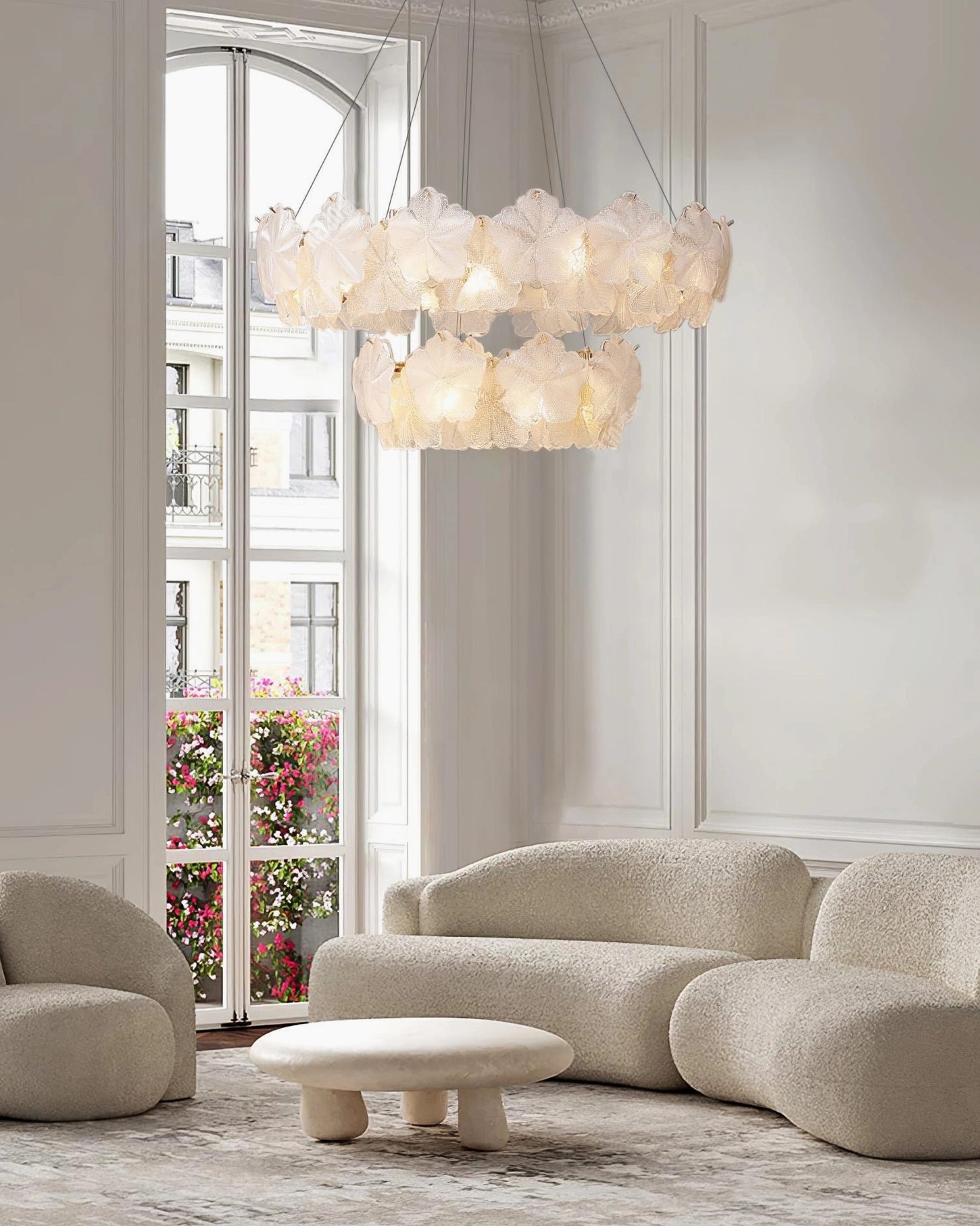 Dual-tier Valery chandelier in French living room with arched window, warm ambient lighting