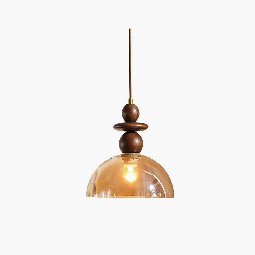 Valeska pendant light with amber glass dome and walnut wood accents, front view on white background