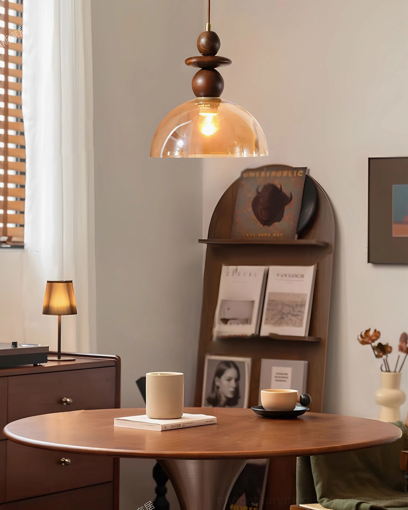 Valeska pendant light illuminating cozy home dining setting with warm retro decor and furniture