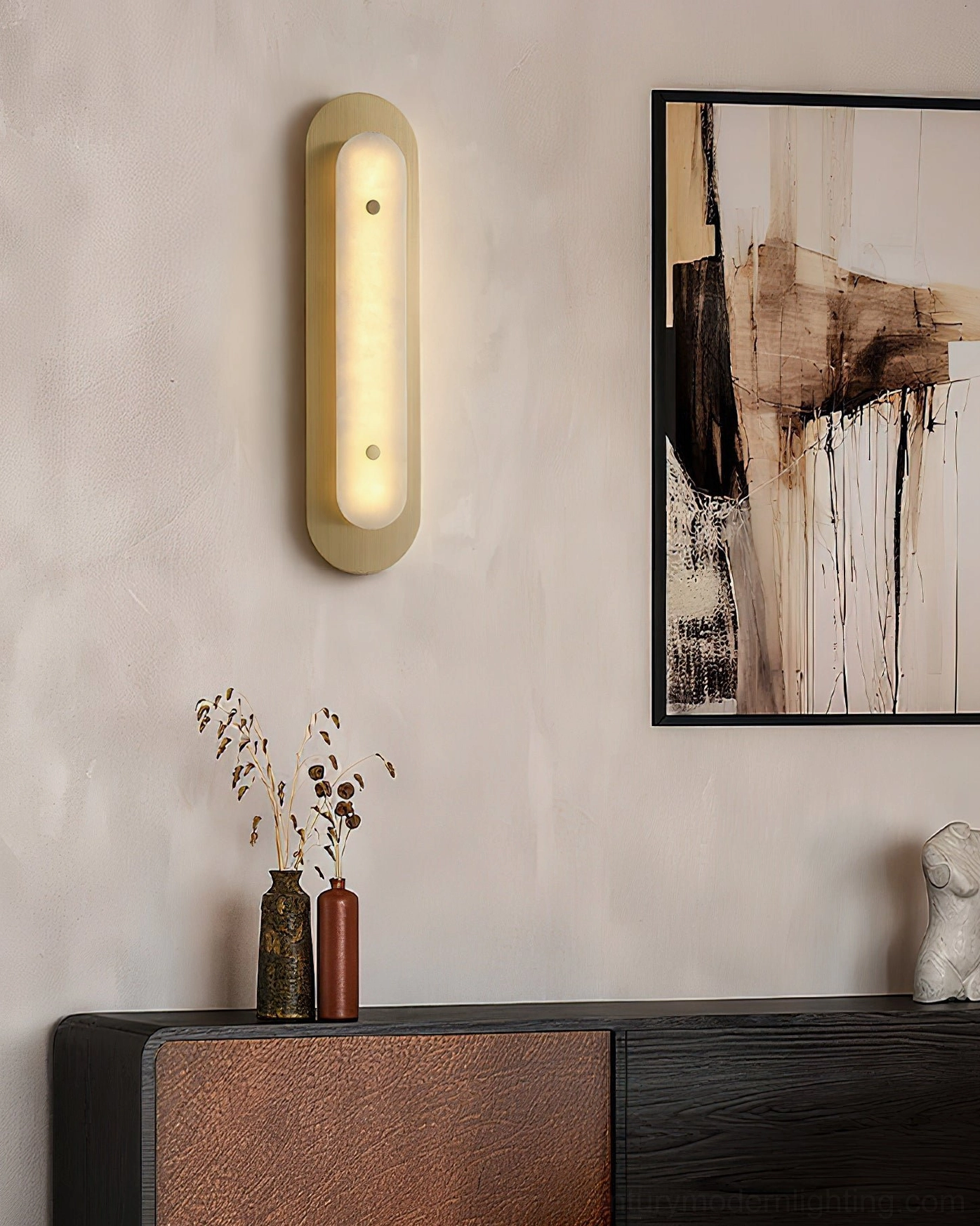 Vance Alabaster Wall Sconce in living room with console table, coordinated home decor styling